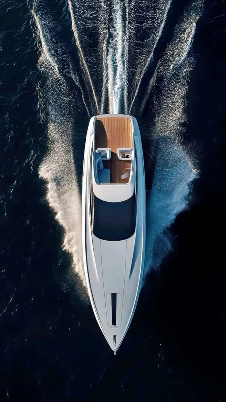 Overhead view of a motor yacht and its wake